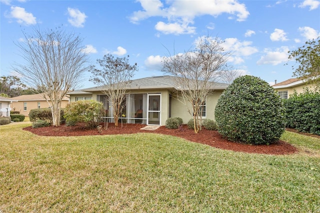 single story home with a front lawn