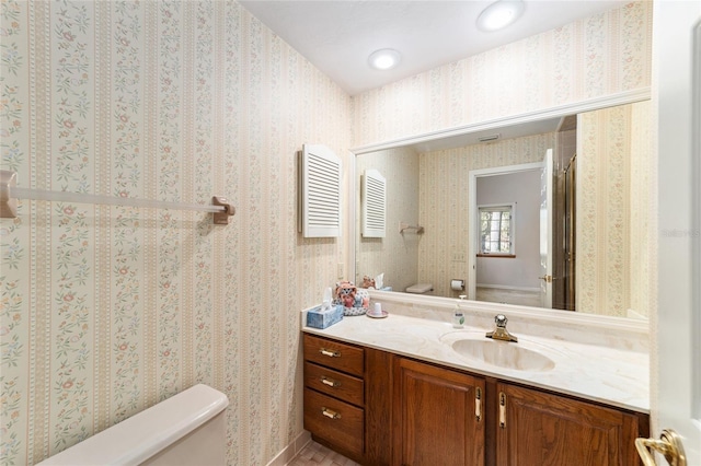 bathroom with vanity and toilet