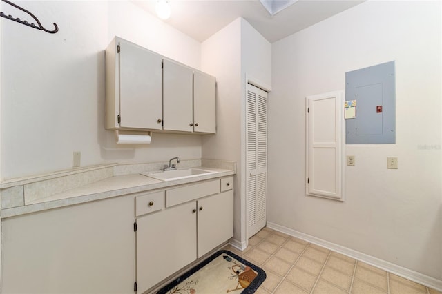 clothes washing area with sink and electric panel