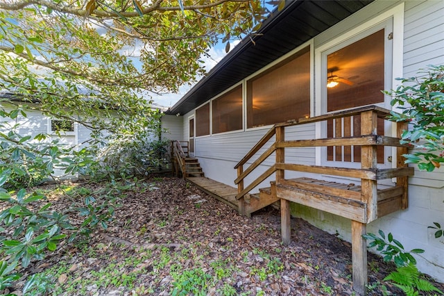 view of side of home with a sunroom