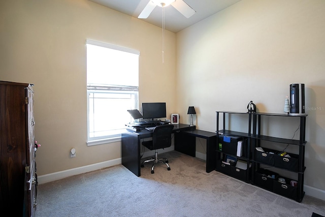 office area with ceiling fan and light carpet