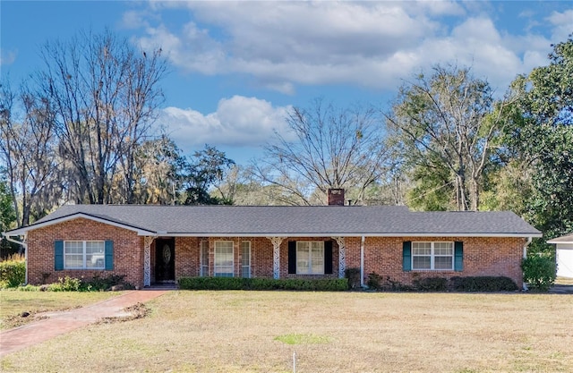 ranch-style home with a front lawn