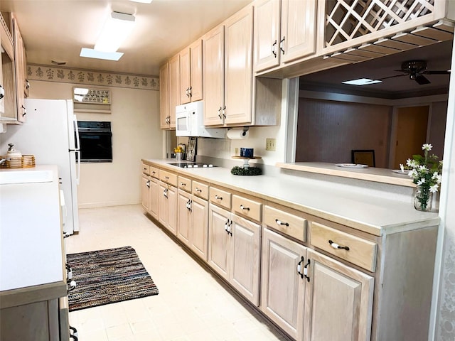 kitchen with ceiling fan, light floors, light brown cabinets, light countertops, and black appliances