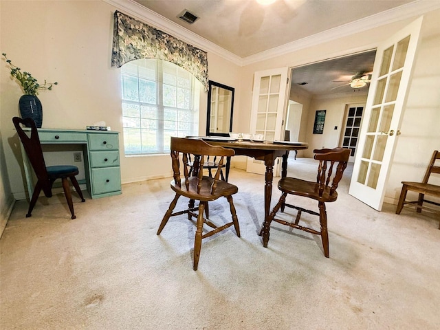 office area with visible vents, ornamental molding, french doors, baseboards, and light colored carpet