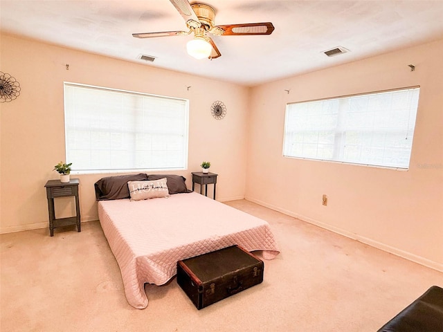 bedroom with visible vents, carpet flooring, and baseboards