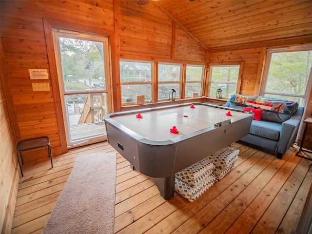 recreation room featuring wooden ceiling, light hardwood / wood-style flooring, wooden walls, and vaulted ceiling