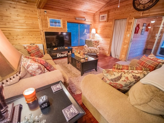 living room with wooden walls, hardwood / wood-style floors, wooden ceiling, and lofted ceiling