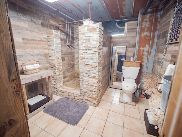 bathroom with toilet and tile patterned flooring