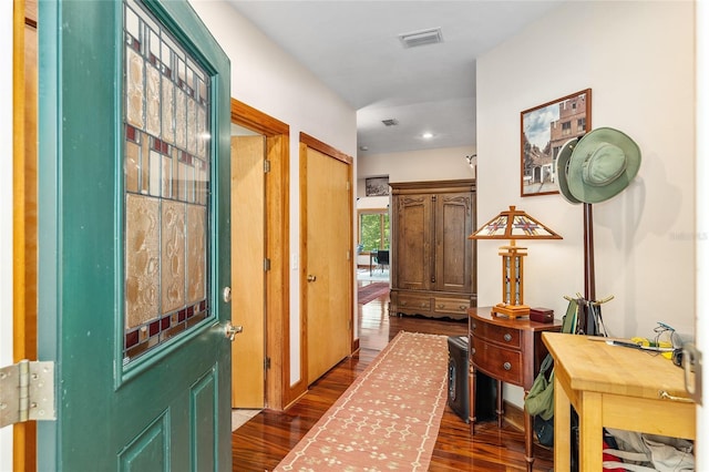 hallway featuring dark wood-type flooring