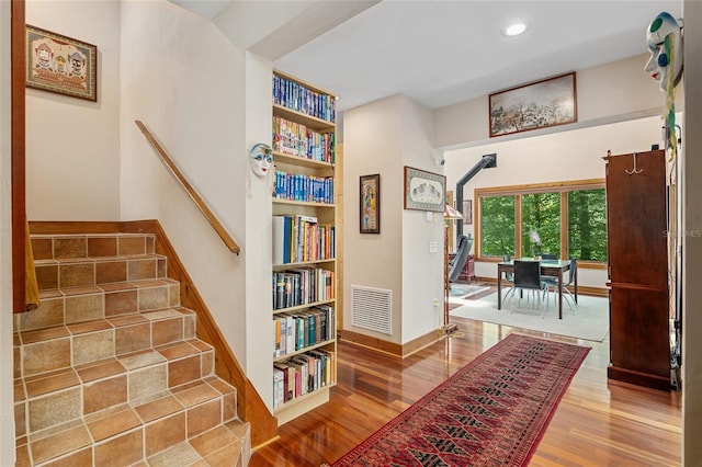 interior space with hardwood / wood-style flooring and built in shelves