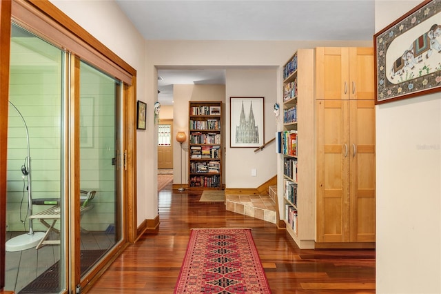 hall with dark wood-type flooring