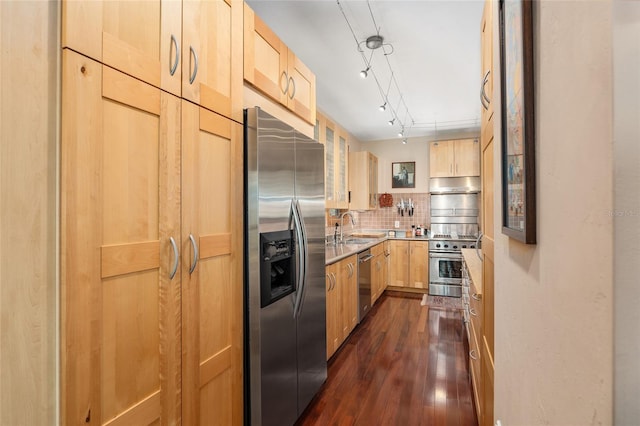 kitchen with light brown cabinets, sink, dark hardwood / wood-style floors, decorative backsplash, and stainless steel appliances