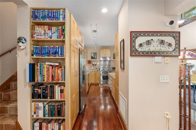 corridor featuring dark hardwood / wood-style floors