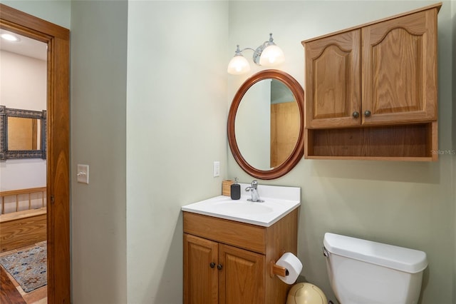 bathroom with vanity and toilet