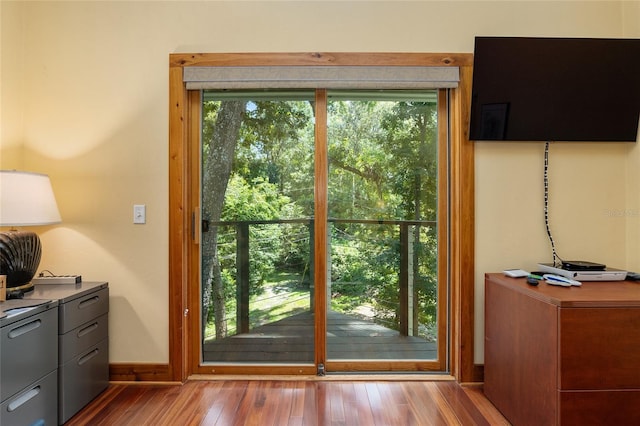 doorway to outside with hardwood / wood-style flooring