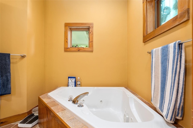 bathroom with a tub and tile patterned floors