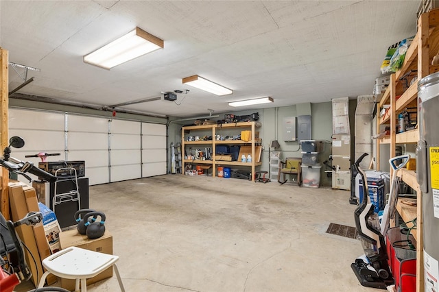 garage featuring electric water heater, electric panel, and a garage door opener