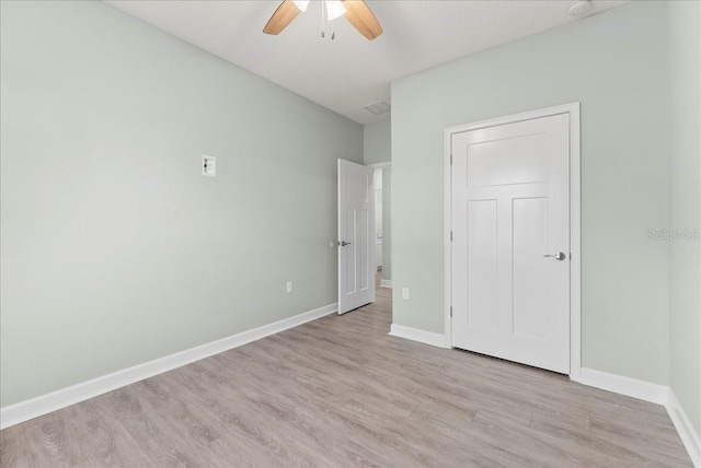 unfurnished bedroom with light hardwood / wood-style floors and ceiling fan