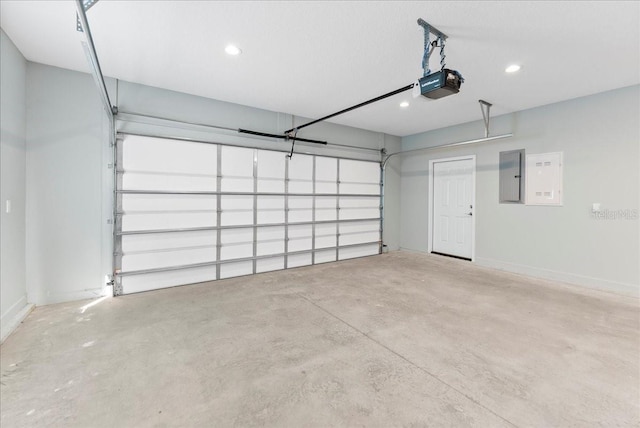 garage featuring a garage door opener and electric panel