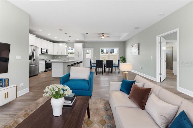 living room featuring dark wood-style floors and baseboards