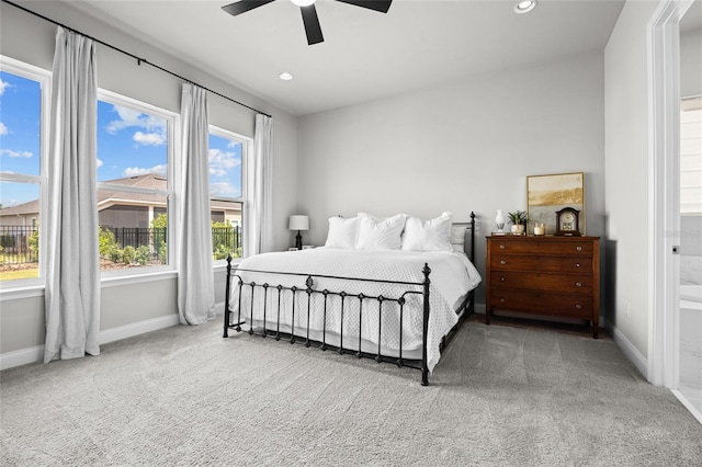 bedroom featuring multiple windows, carpet flooring, and ceiling fan