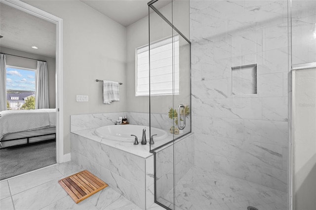 full bathroom with a bath, marble finish floor, a shower stall, and ensuite bathroom