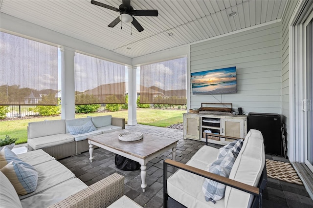 sunroom / solarium with ceiling fan