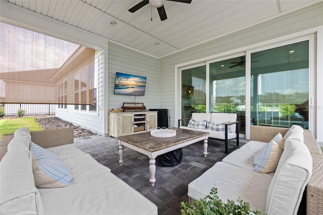 view of patio featuring an outdoor hangout area, area for grilling, and a ceiling fan