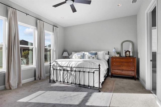 bedroom with visible vents, a ceiling fan, baseboards, and carpet floors