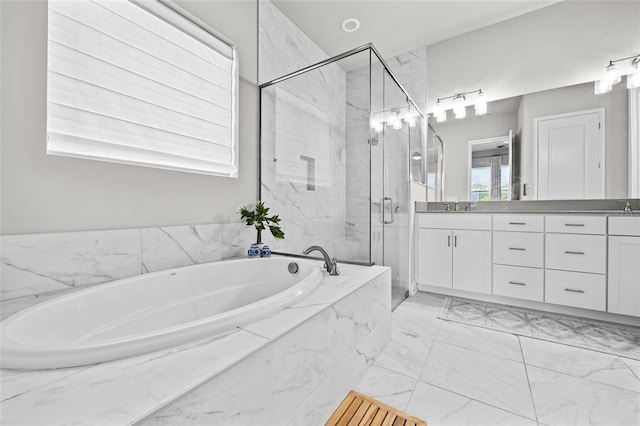 full bathroom featuring a marble finish shower, double vanity, a sink, a garden tub, and marble finish floor