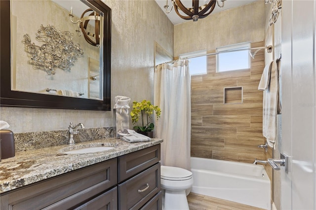 full bathroom featuring shower / bathtub combination with curtain, vanity, and toilet