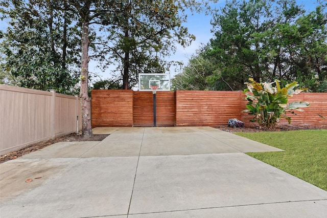 view of patio / terrace with basketball hoop