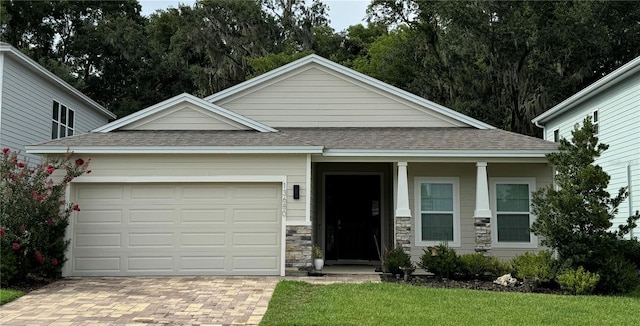 view of front of house featuring a garage and a front yard