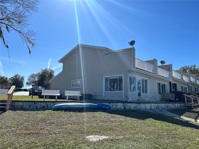 view of side of property with a yard