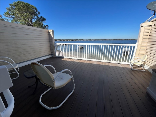 wooden deck with a water view