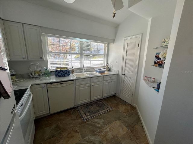 kitchen with white cabinetry, vaulted ceiling, sink, and white appliances