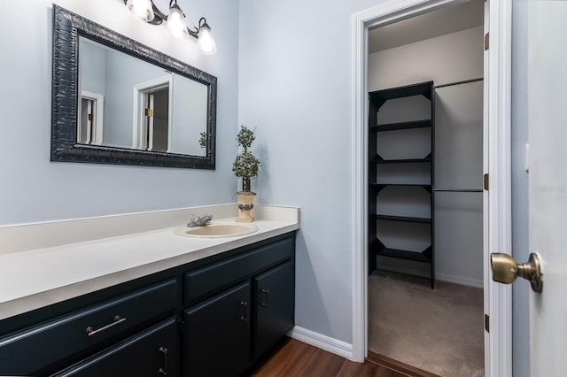 bathroom featuring vanity and wood-type flooring