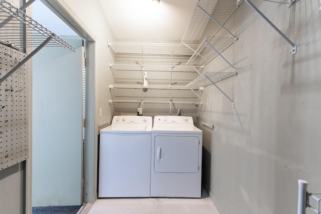 washroom with independent washer and dryer