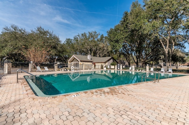 view of swimming pool featuring a patio