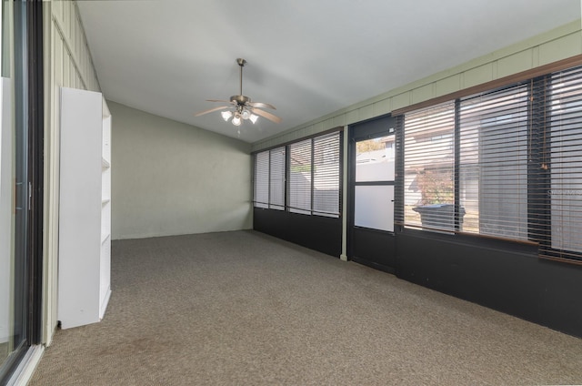 unfurnished sunroom with lofted ceiling and ceiling fan