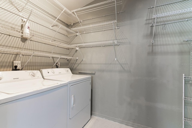 clothes washing area with independent washer and dryer