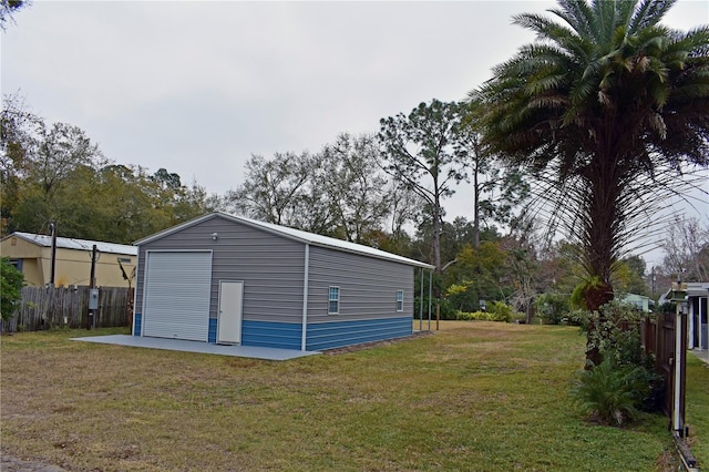 view of outdoor structure featuring a lawn