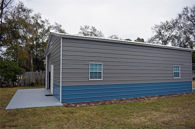 view of home's exterior featuring a patio and a lawn