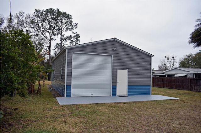 garage featuring a yard