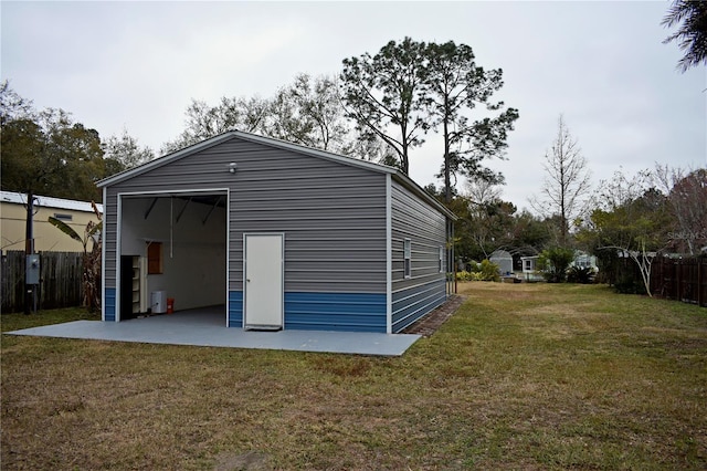 view of outbuilding with a yard