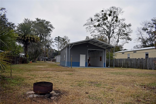 view of outbuilding with a yard