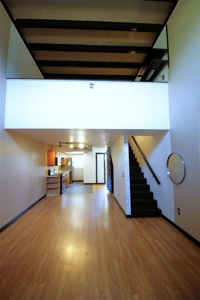 unfurnished living room with light wood-type flooring