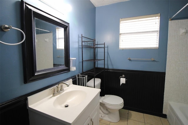 full bathroom featuring tile patterned flooring, vanity, bathtub / shower combination, and toilet