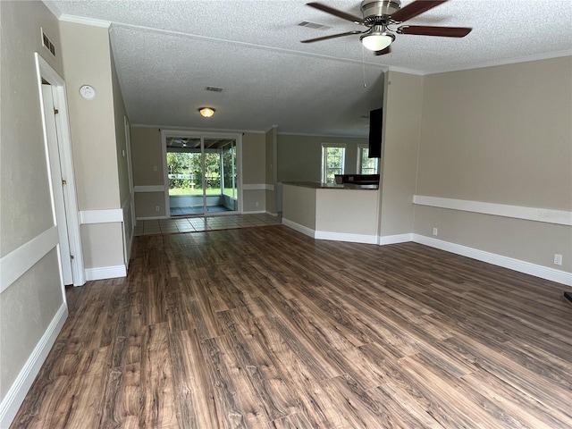 unfurnished living room with hardwood / wood-style floors, crown molding, a textured ceiling, and ceiling fan