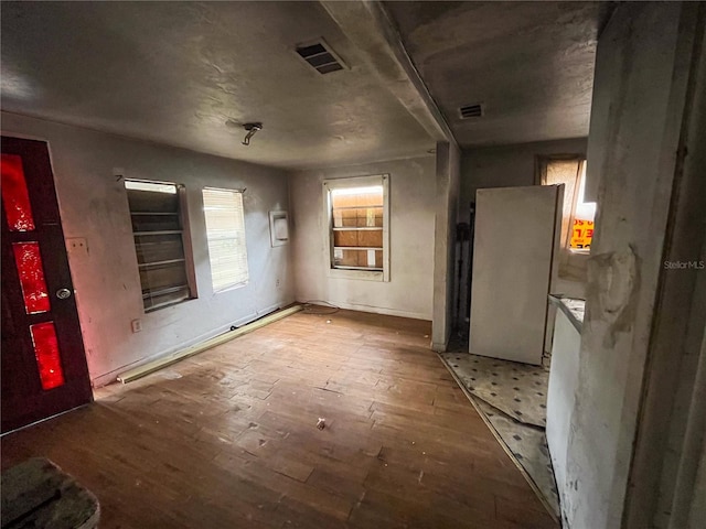 spare room with light wood-type flooring